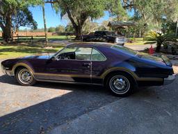 1966 Oldsmobile Toronado Coupe. Older restoration done to the theme of a Hu