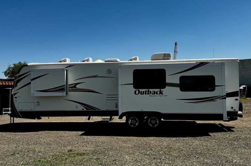 2013 Keystone Outback Super-Lite 298RE Travel Trailer with Three Slide Outs