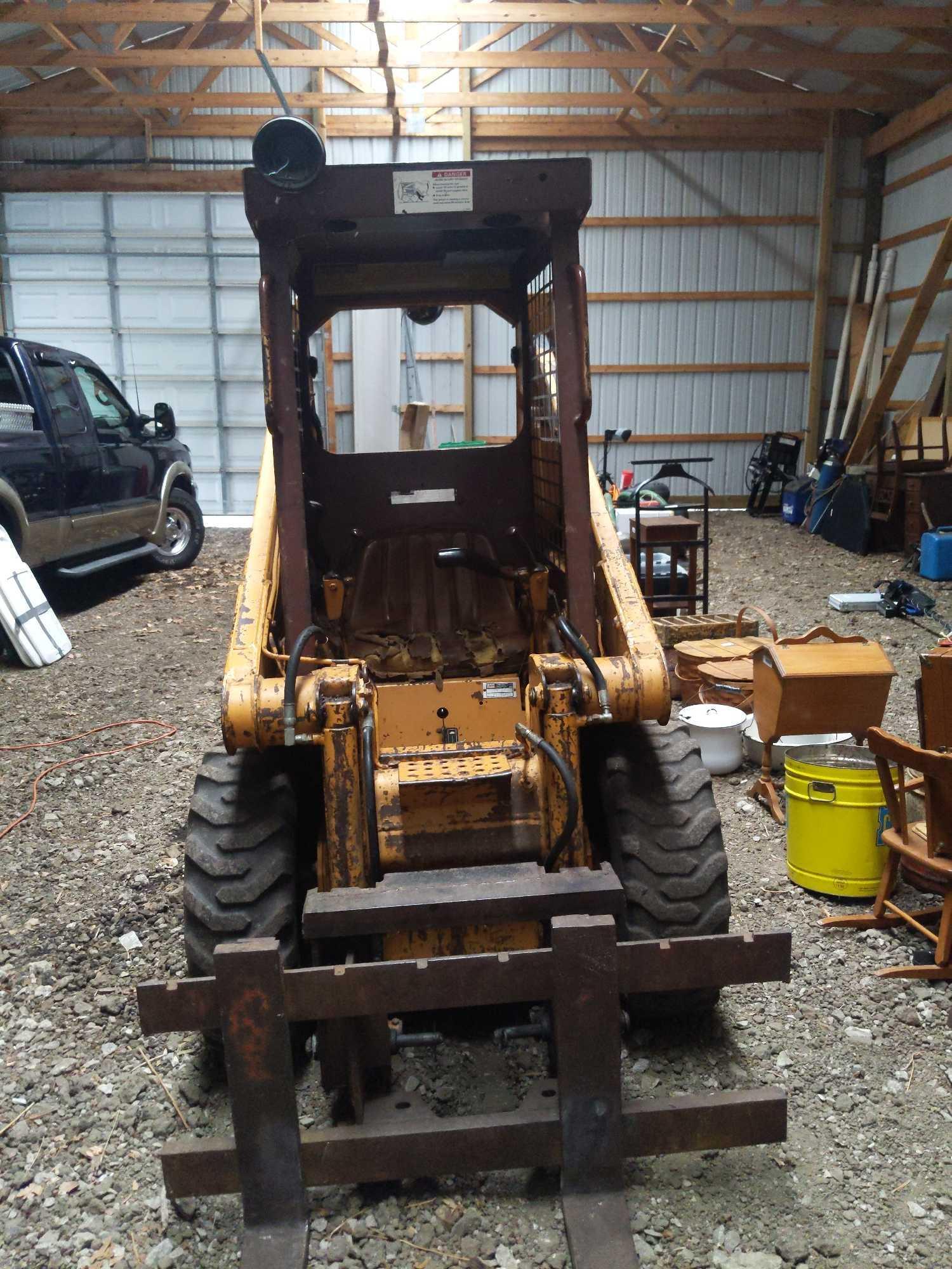 B- Case 1818 Skid Steer with Snow Plow, Bucket, and Forks