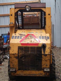 B- Case 1818 Skid Steer with Snow Plow, Bucket, and Forks