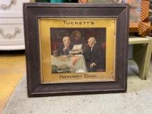 METAL SIGN OF MR TUCKETT AND FRIEND ENJOYING PREFERRED PERFECTORS CIGARS, IN WOOD FRAME, APPROX 22 X