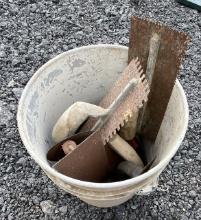 Bucket of Tile Trowels