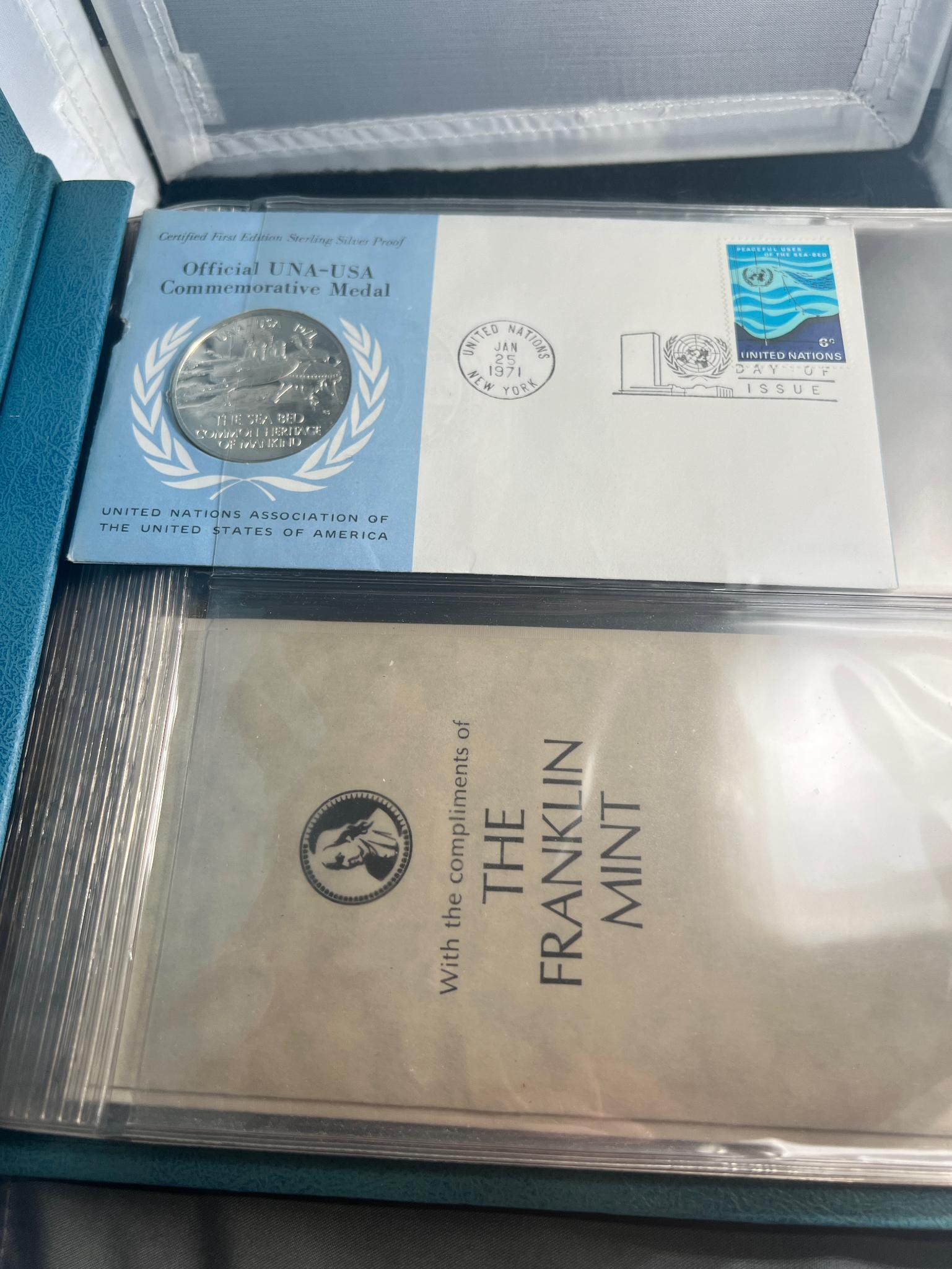 Franklin Mint United Nations Sterling medal w/ info card, and stamp/ postmark and collection book...