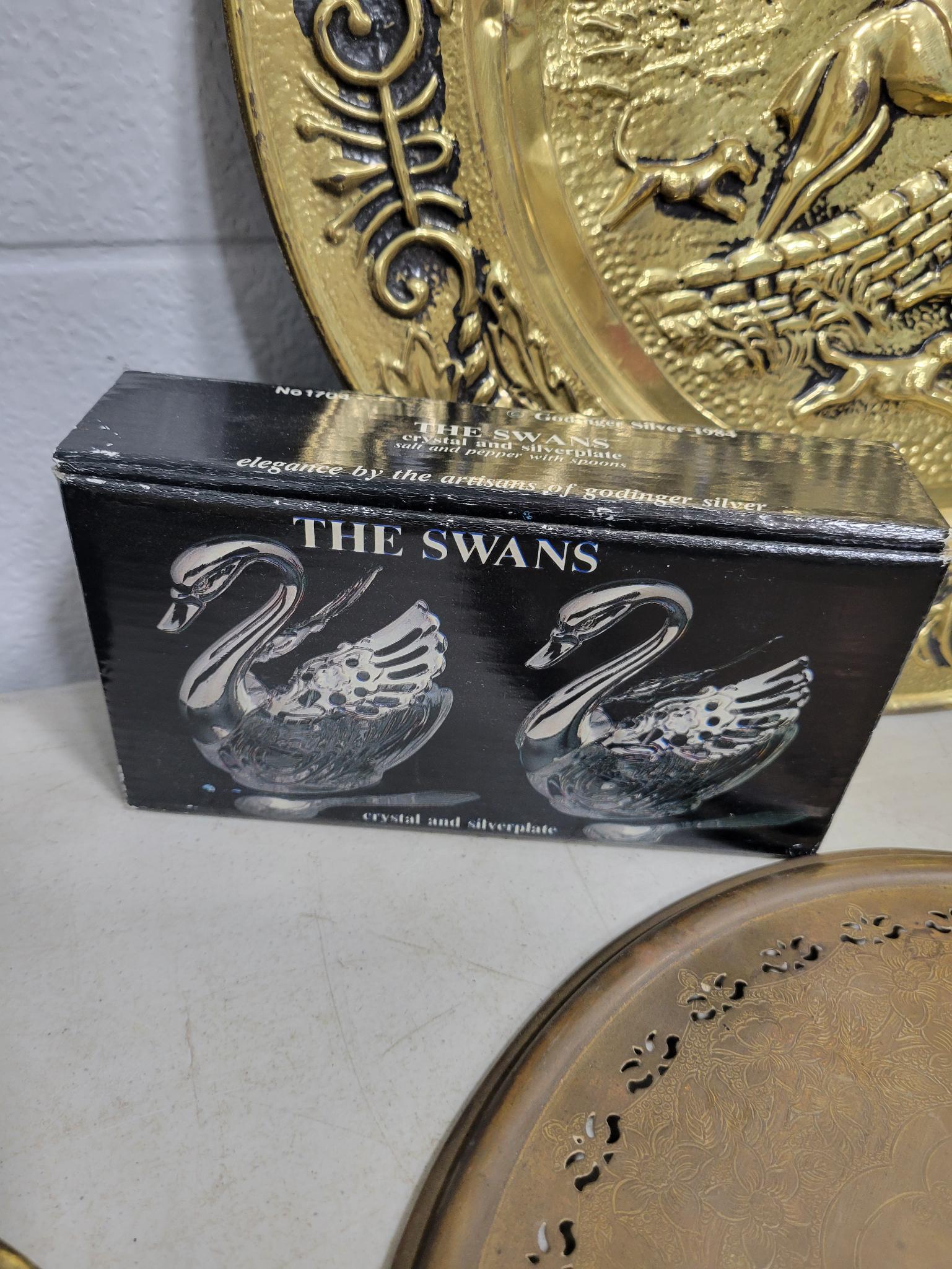 7 metal plates and swan napkin holder and salt and pepper