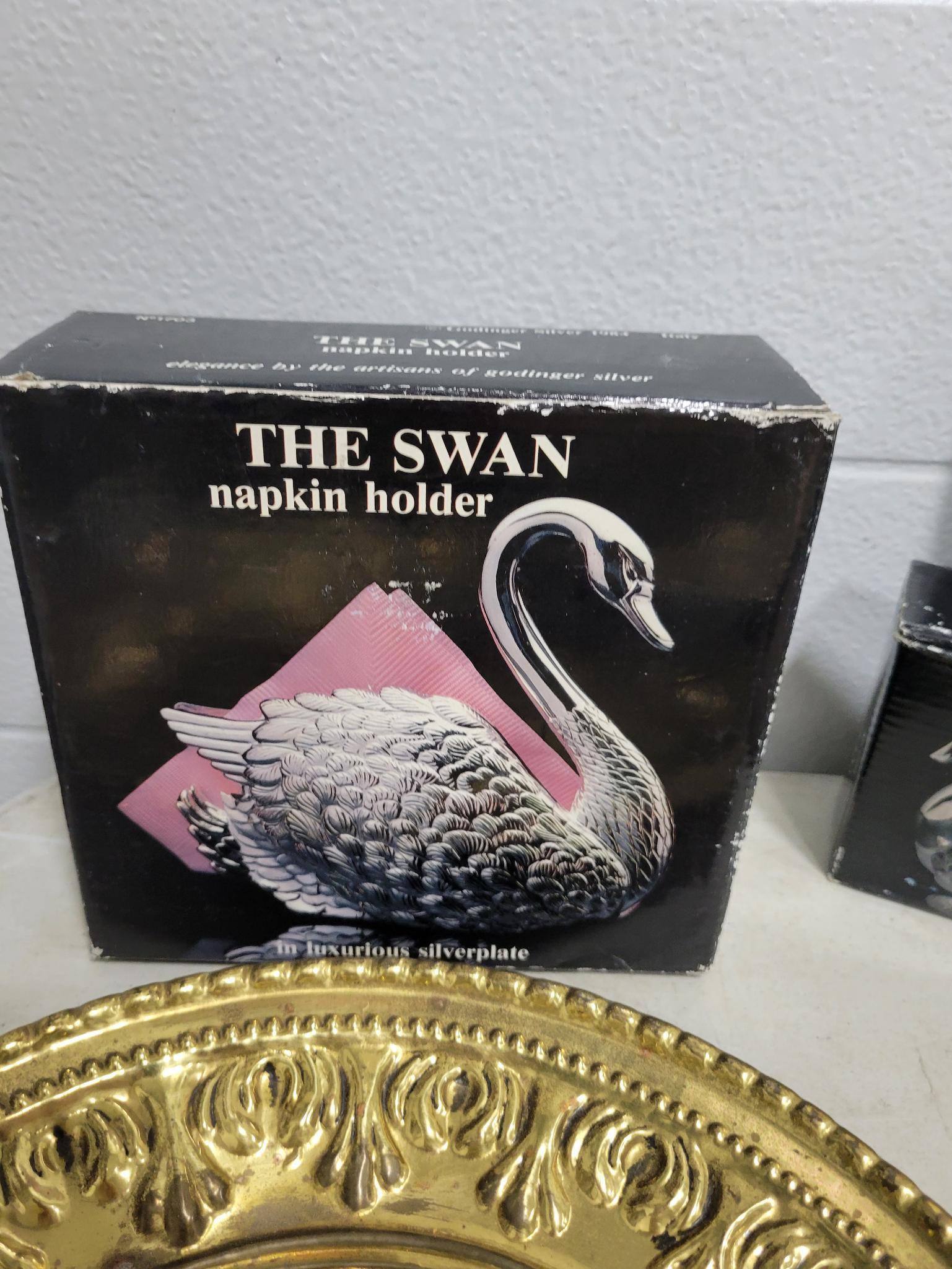 7 metal plates and swan napkin holder and salt and pepper