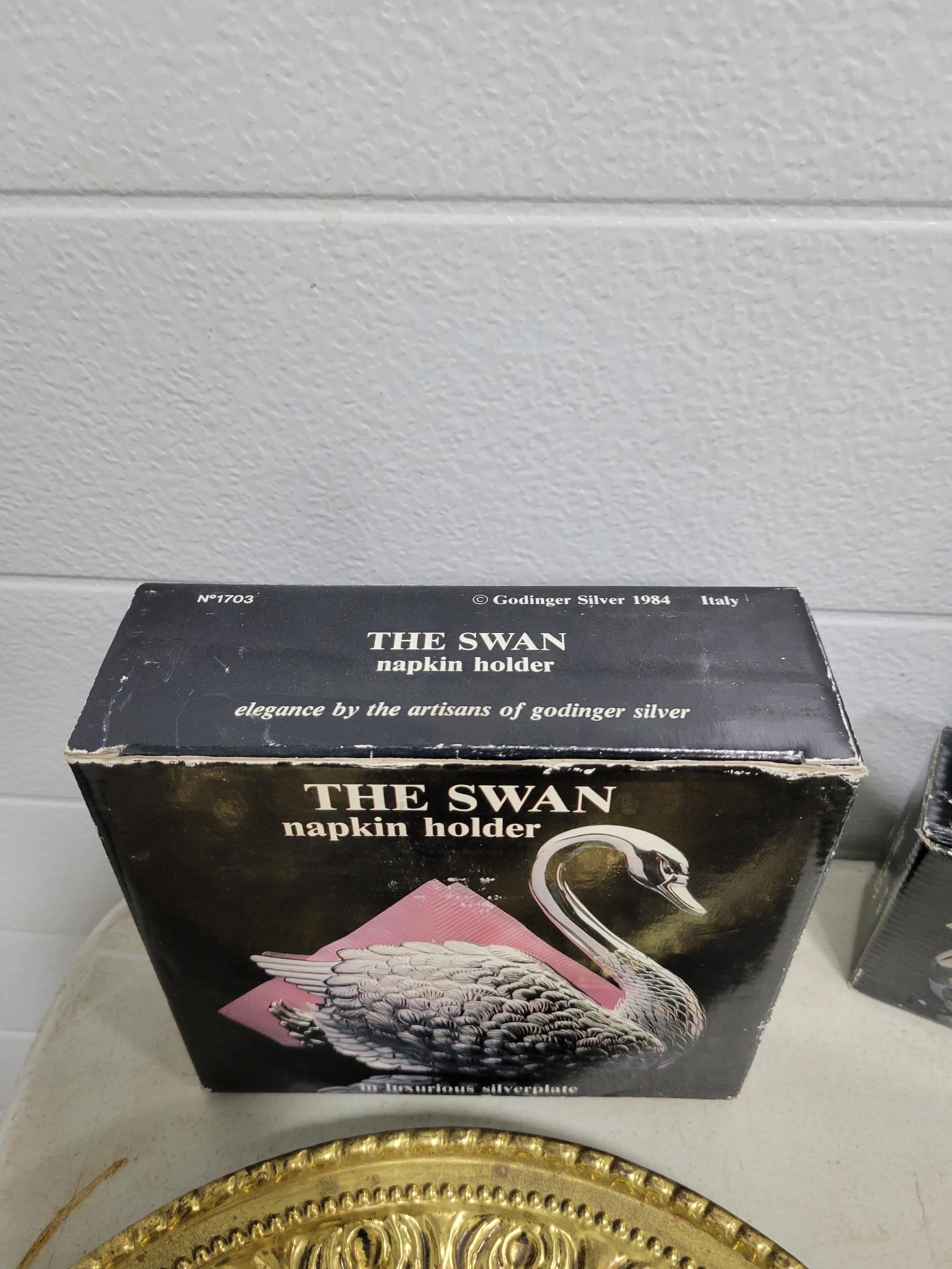 7 metal plates and swan napkin holder and salt and pepper