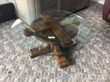 Glass top coffee table with wood base