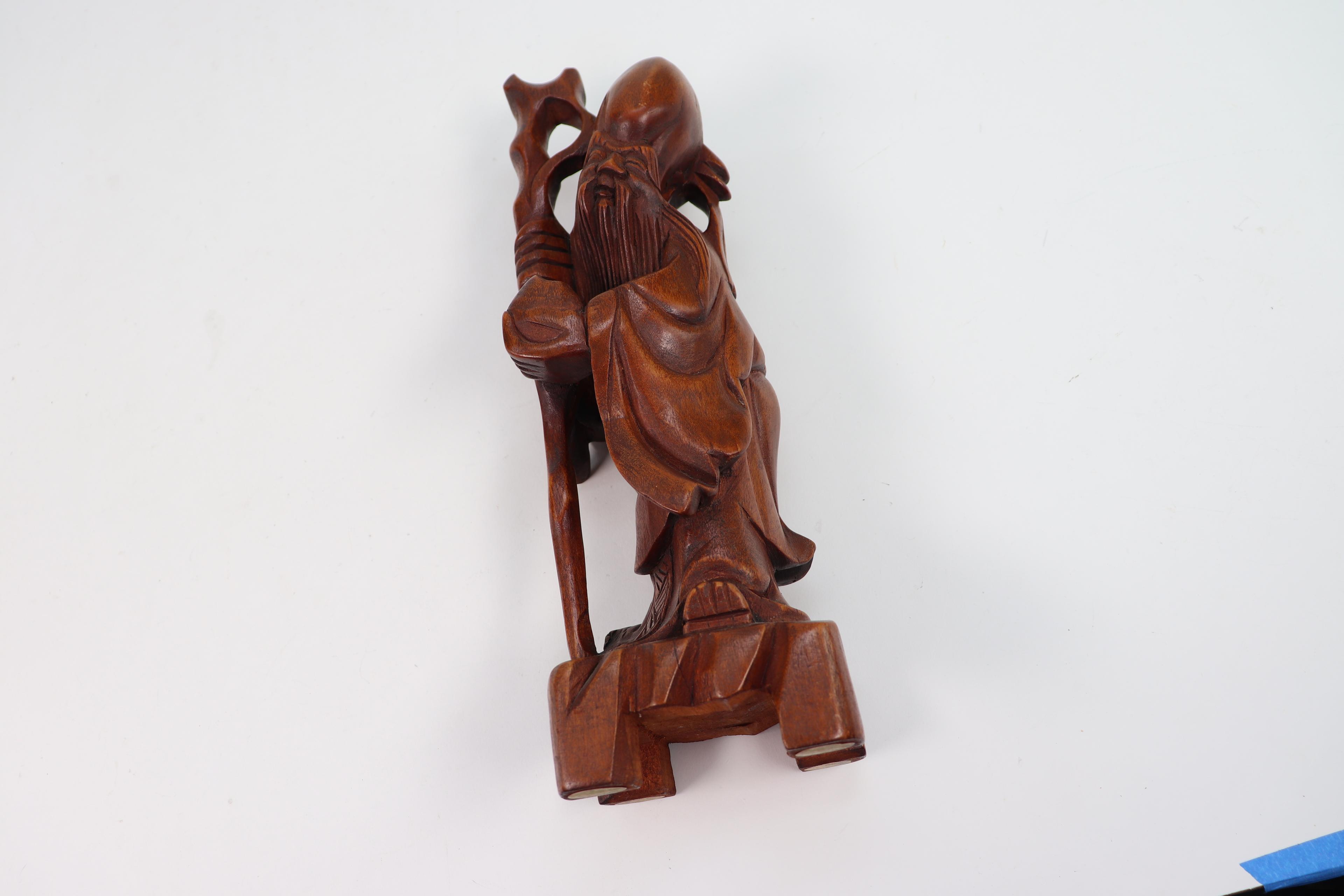 Carved Wooden Asian Sculptures