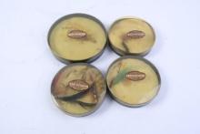 Four round plastic tins with L.L. Bean fishing flies