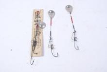 Three Water Gremlin Minnow Harness lures, one on the original card