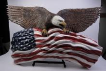 Carved wooden eagle and American Flag