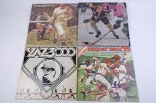 Four sports related record albums