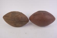 Two vintage Wilson footballs