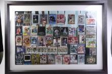 Framed collage of forty-nine assorted sports cards from baseball, hockey, basketball, and football