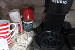 Keurig with Coffee Cups, Pods and Stand.