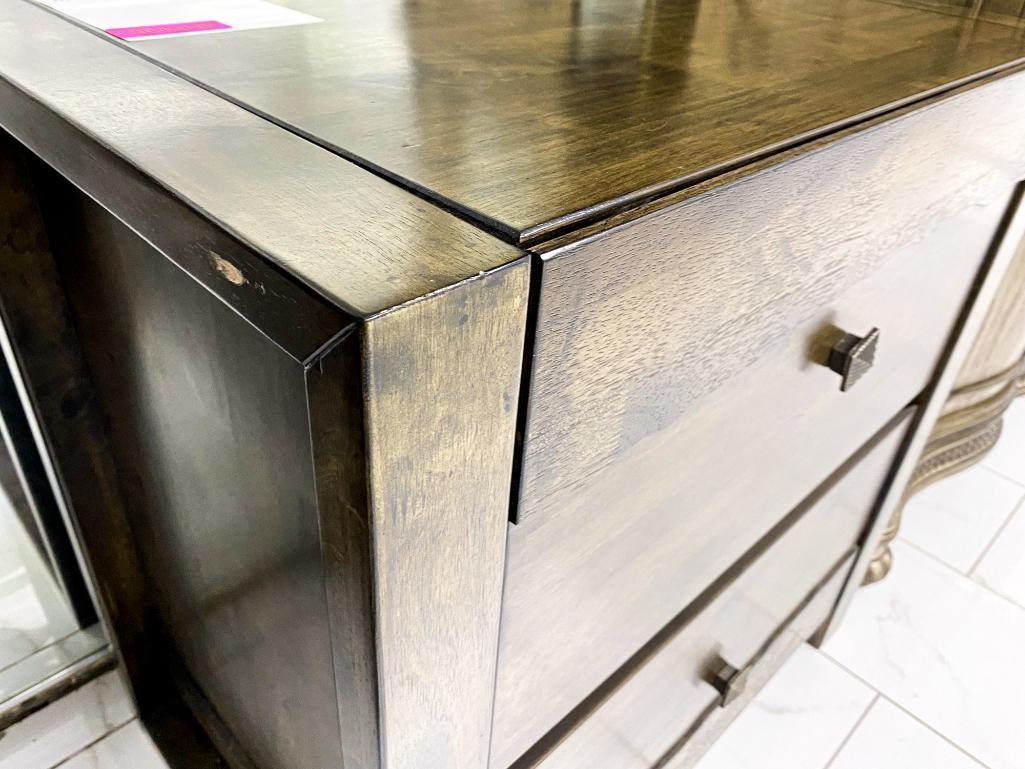 Traditional brown nightstand with striped knobs