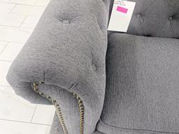 Grey fabric loveseat