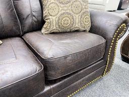 Brown fabric two-seater loveseat