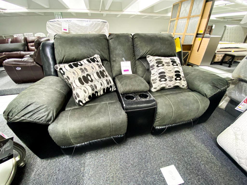 Black fabric/ leather loveseat with center storage console, and 2 electric recliners