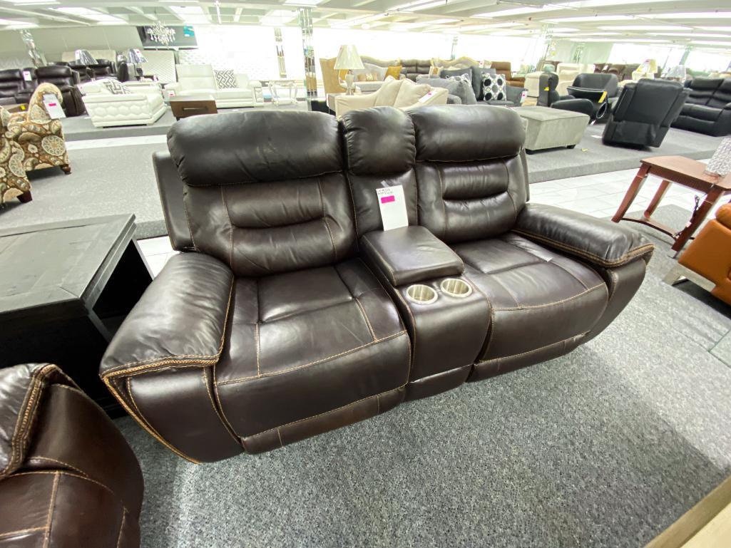 Dark, brown loveseat, with middle console, electronic, recliners, and two cupholders