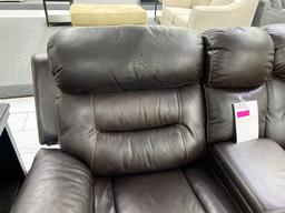 Dark, brown loveseat, with middle console, electronic, recliners, and two cupholders