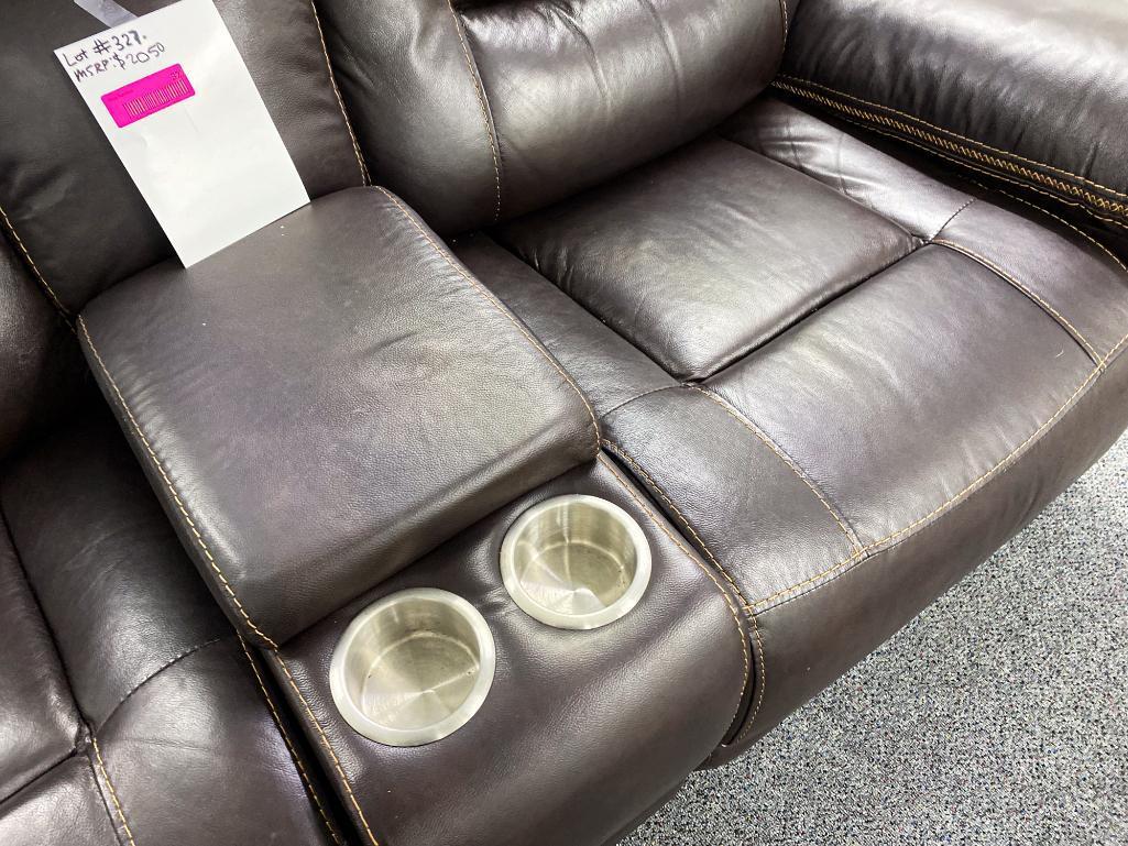 Dark, brown loveseat, with middle console, electronic, recliners, and two cupholders