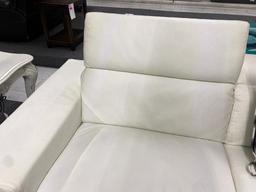 mad, white leather sofa, and loveseat