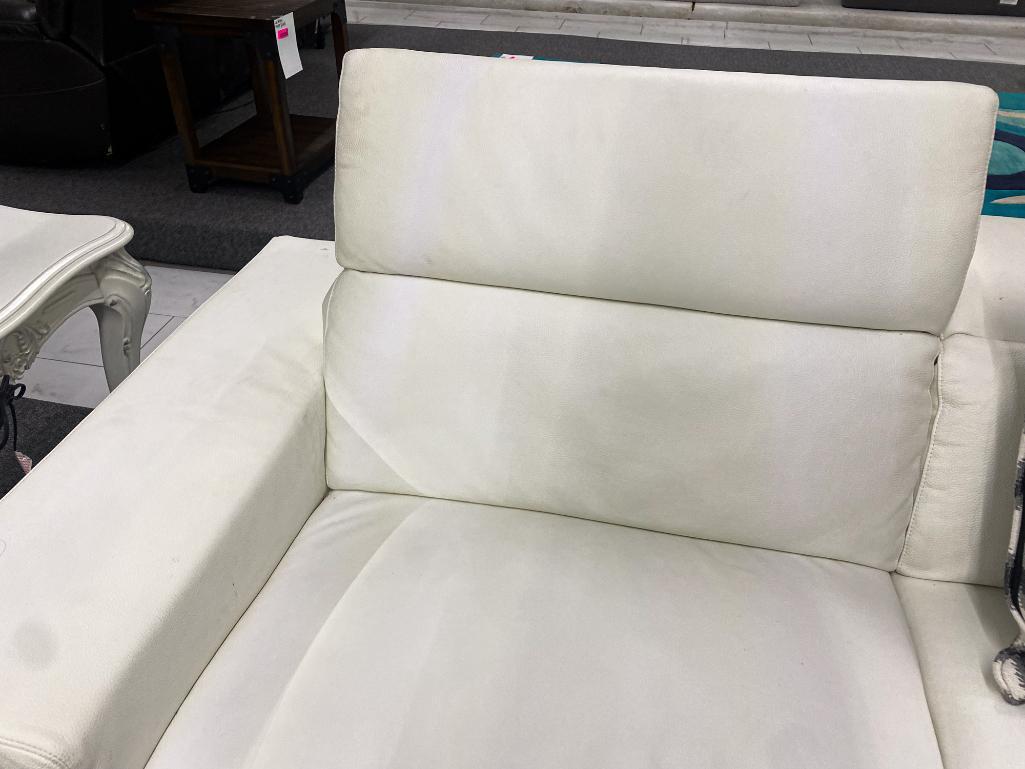 mad, white leather sofa, and loveseat