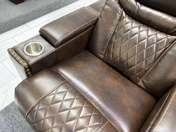 Traditional loveseat with electronic recliners and middle storage console, has 2 cupholders