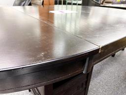 Oval dark wood dining table