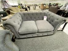 Grey fabric loveseat