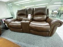 Traditional brown loveseat with electronic recliners and middle storage console, has 2 Cupholders