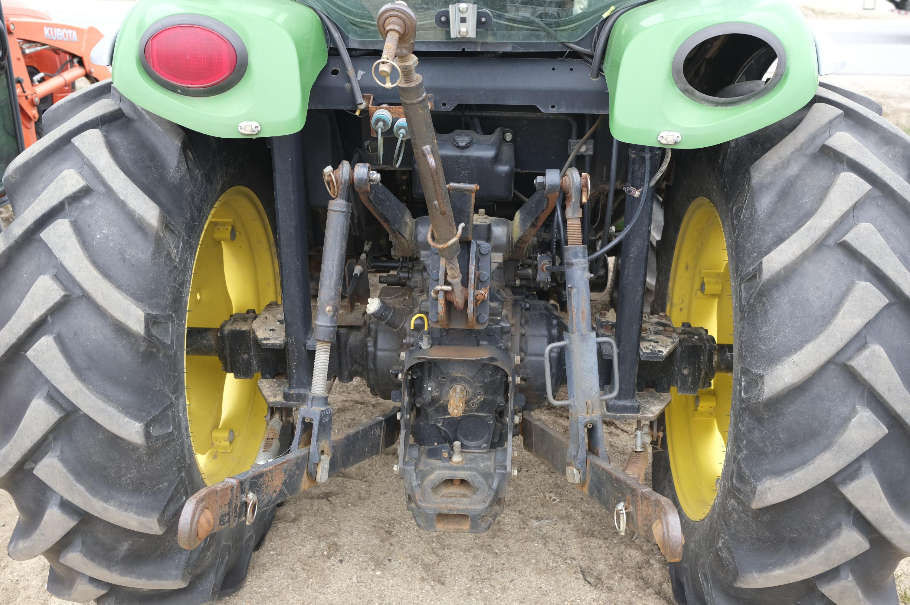 John Deere 4320 tractor with front bucket