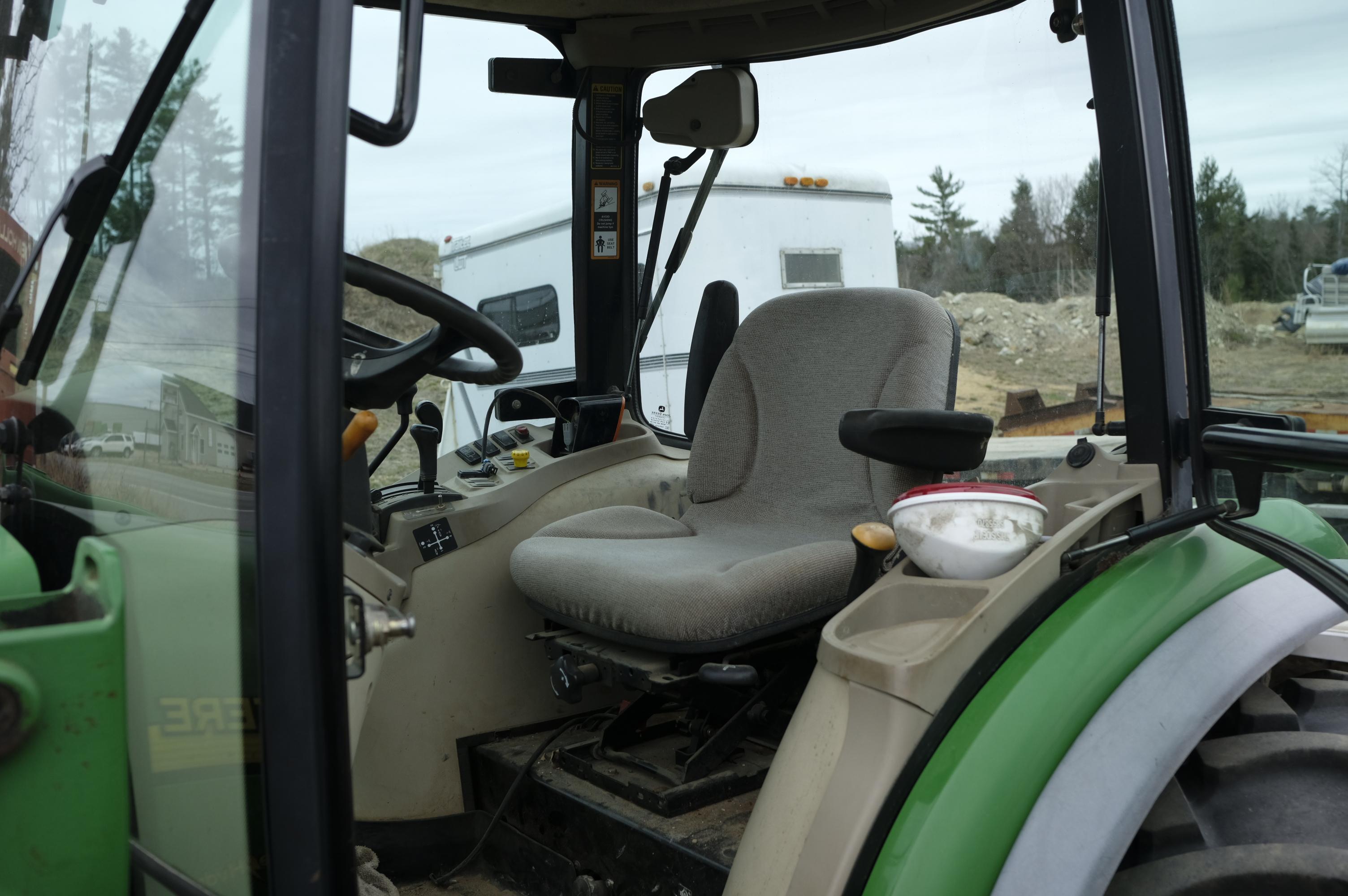 John Deere 4320 tractor with front bucket