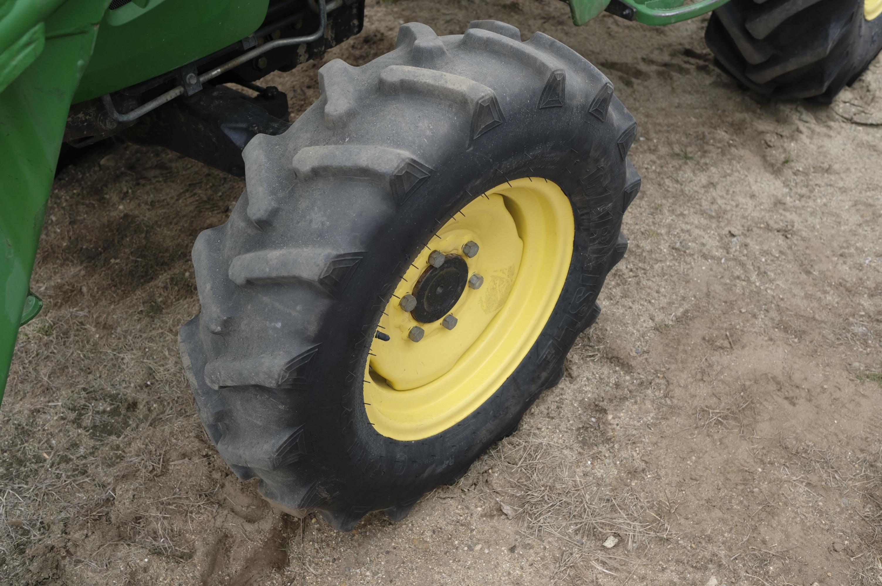 John Deere 4320 tractor with front bucket