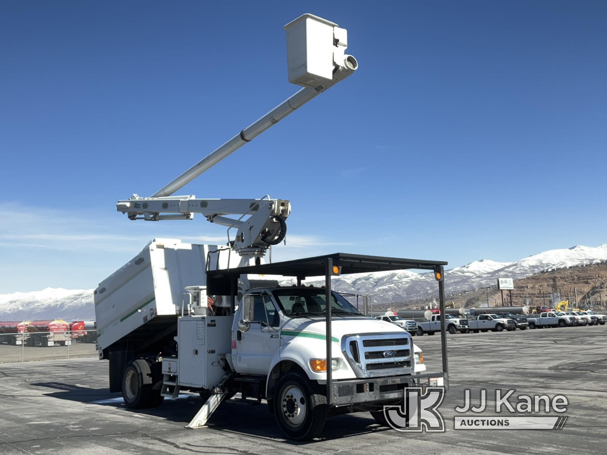 (Salt Lake City, UT) Altec LR760E70, mounted behind cab on 2013 Ford F750 Chipper Dump Truck Runs, M