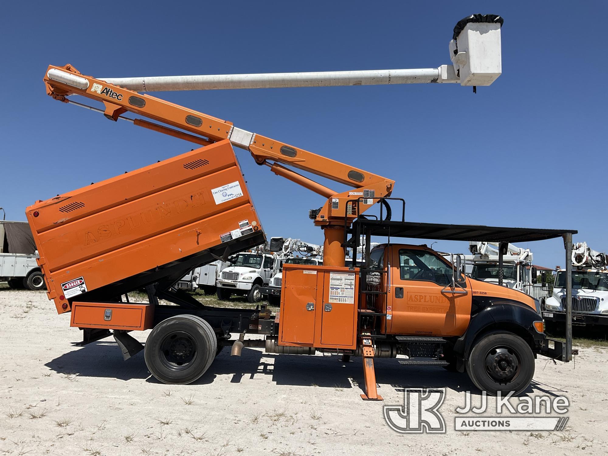 (Westlake, FL) Altec LR756, Over-Center Bucket Truck mounted behind cab on 2013 Ford F750 Chipper Du