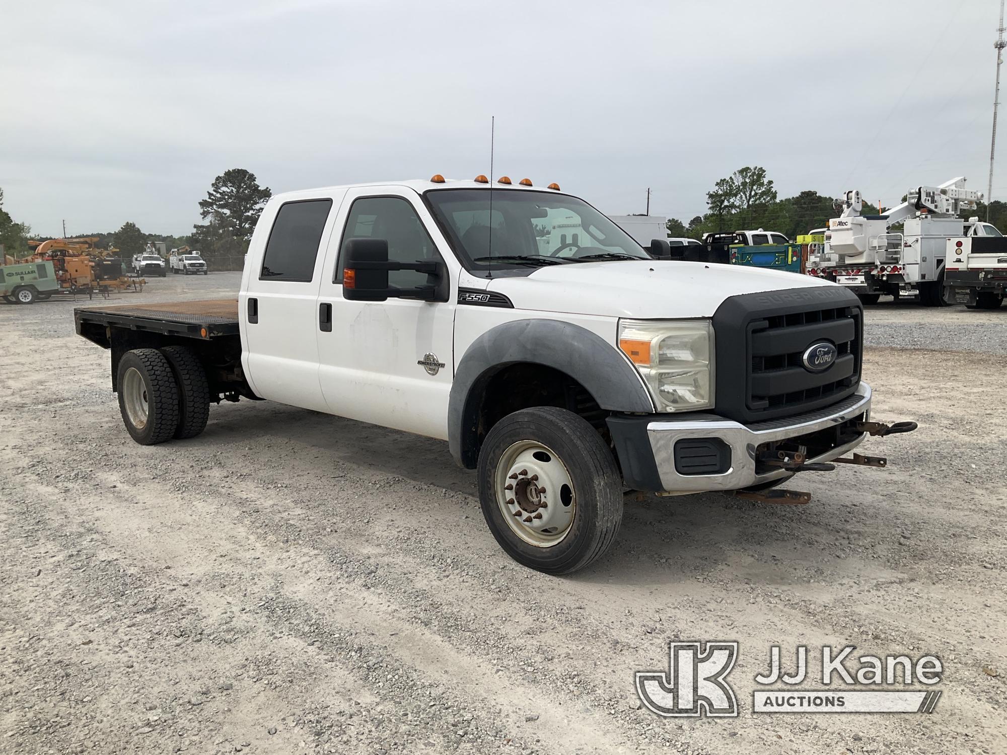 (Villa Rica, GA) 2011 Ford F550 4x4 Crew-Cab Flatbed Truck Runs & Moves) (Jump To Start, Body Damage