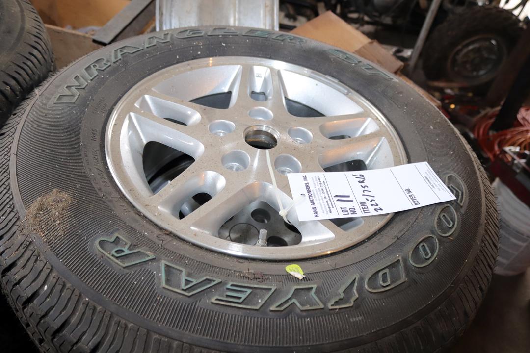 SET OF GOODYEAR WRANGLER ST TIRES W/ ALUMINUM RIMS 225 75R 16, WOULD FIT ON A JEEP