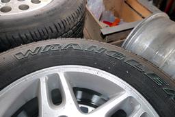 SET OF GOODYEAR WRANGLER ST TIRES W/ ALUMINUM RIMS 225 75R 16, WOULD FIT ON A JEEP