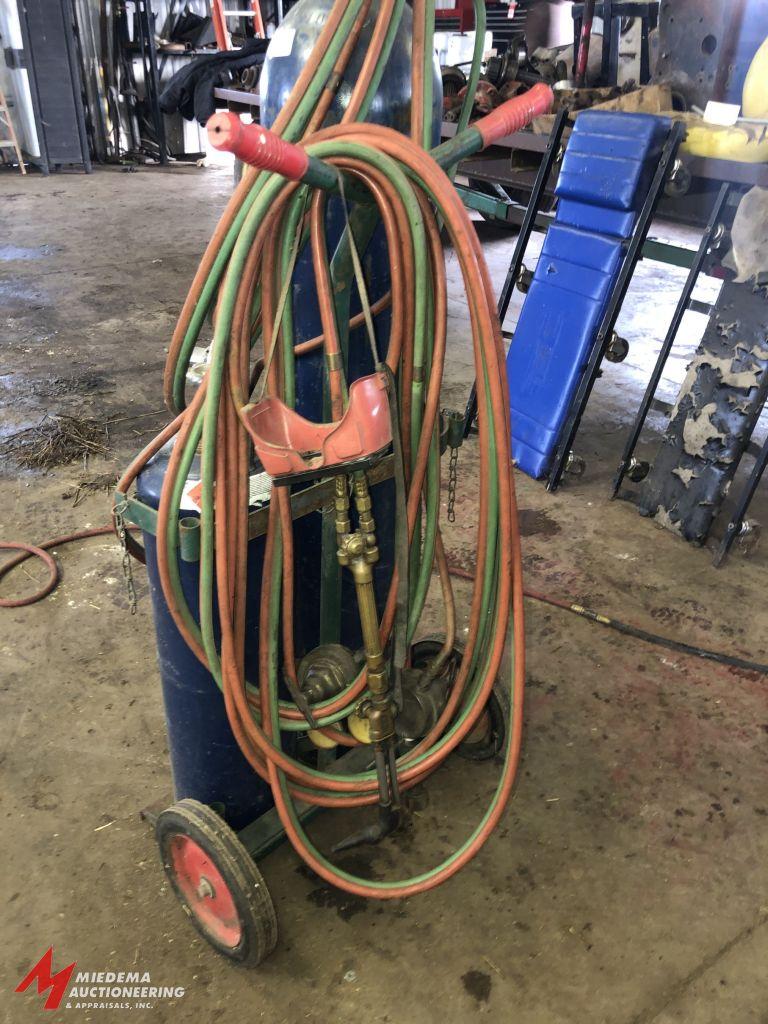 OXYGEN/ACETYLENE TANK CART WITH APPROX. 30' OF HOSE, GOGGLES, TORCH, AND REGULATORS (TANKS ARE BELIE