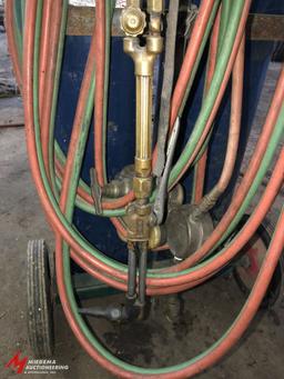 OXYGEN/ACETYLENE TANK CART WITH APPROX. 30' OF HOSE, GOGGLES, TORCH, AND REGULATORS (TANKS ARE BELIE