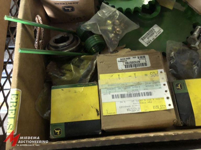 BOX OF ASSORTED JOHN DEERE 467 ROUND BALER PARTS, MOST APPEAR TO BE NEW.