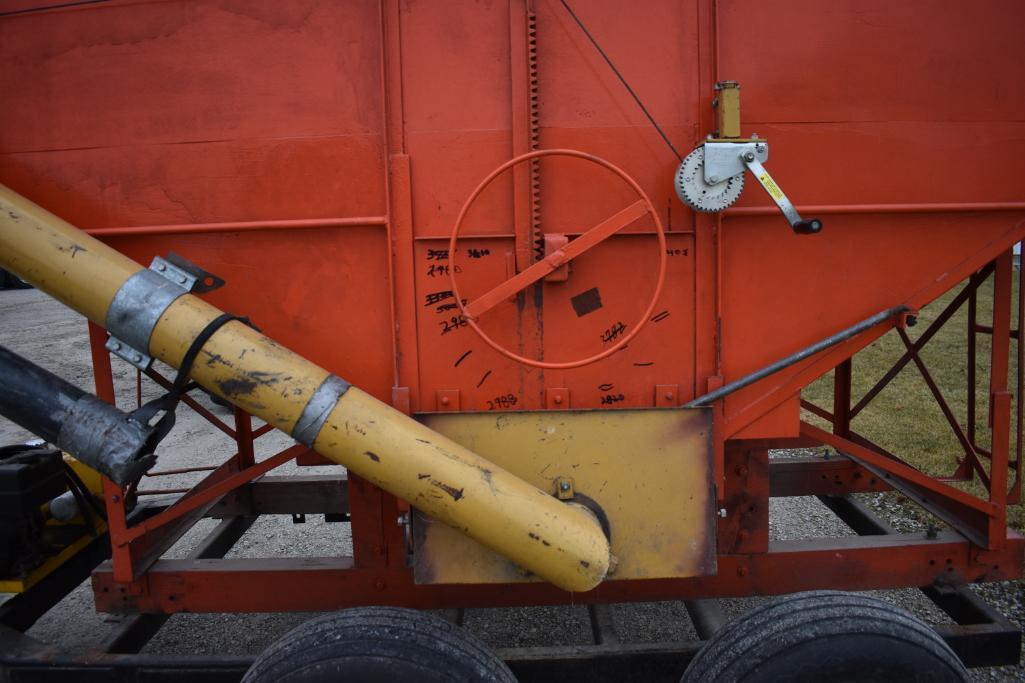 Killbros 250 gravity wagon mounted on tandem axle flatbed trailer