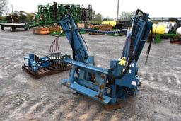 Skid steer mounted tree spade with weights and rear cylinders