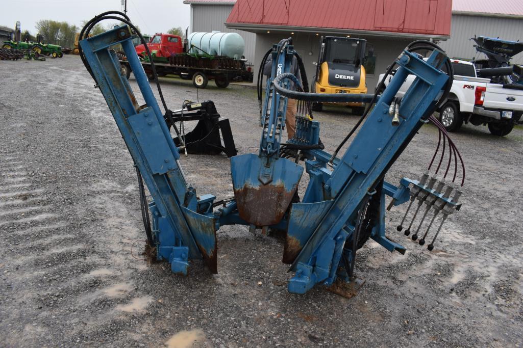 Skid steer mounted tree spade with weights and rear cylinders