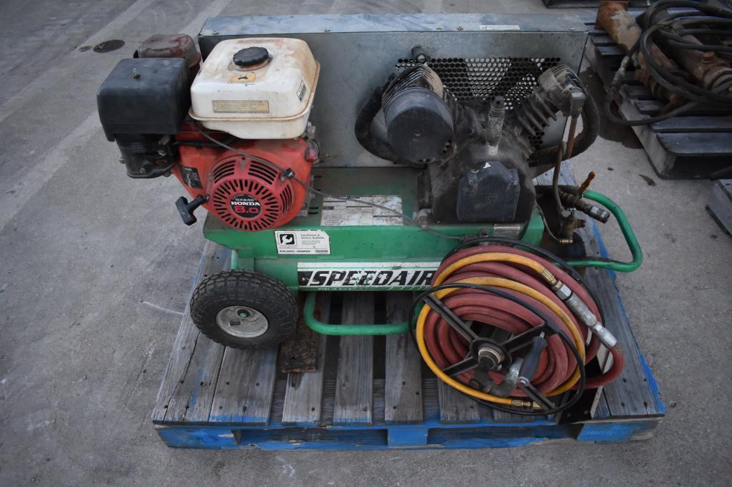 Speedaire portable air compressor, Honda GX240 eng., hose reel