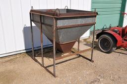 Galvanized feed hopper on steel skid