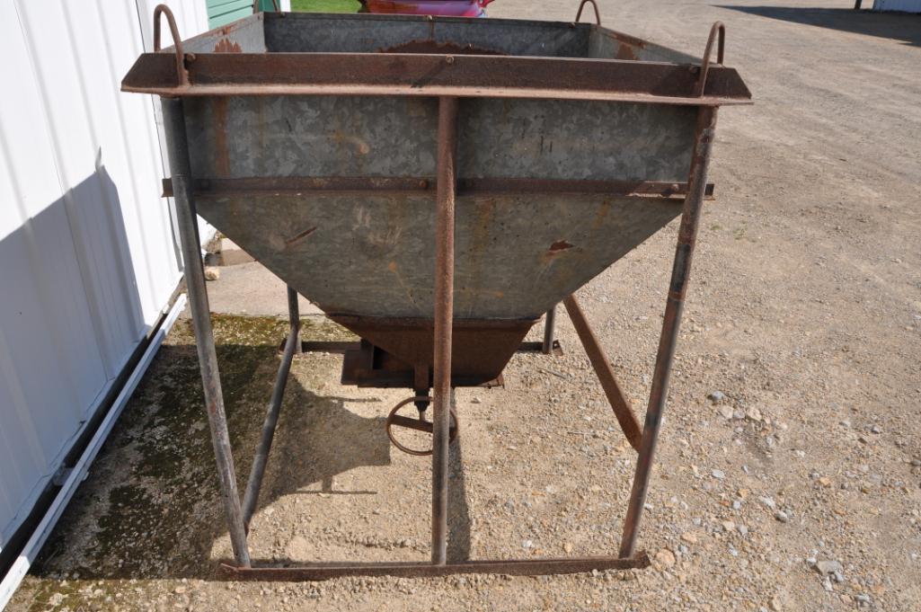 Galvanized feed hopper on steel skid