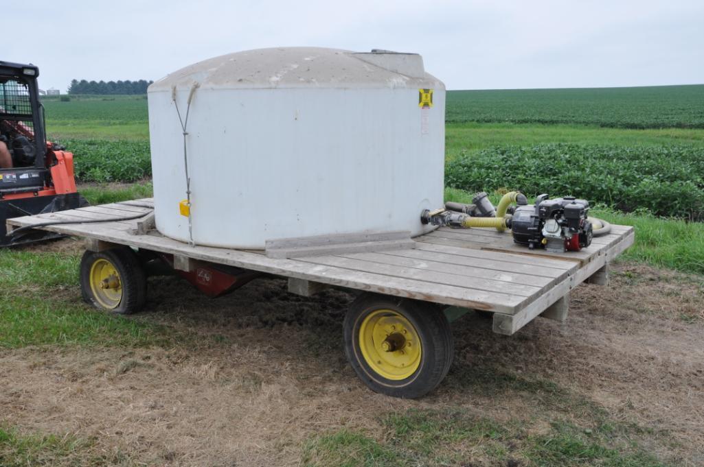 14' wooden hayrack on JD running gear w/tank & pump